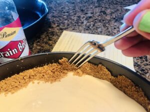 Using a fork, scrape off any excess crust onto top of filling.