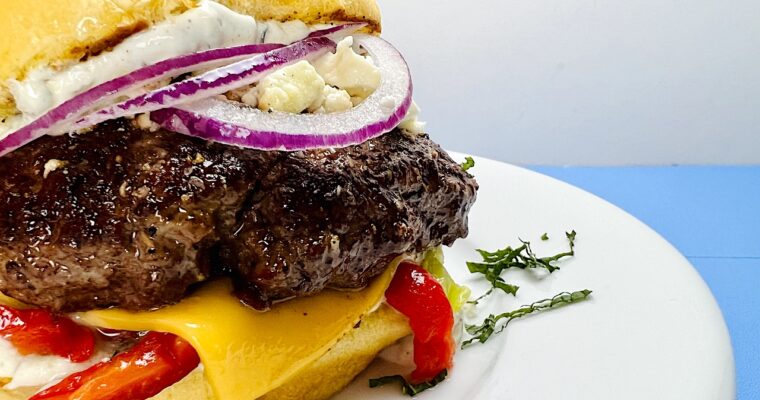 Juicy Lamburgers with Feta, Mint Tzatziki, and Roasted Peppers